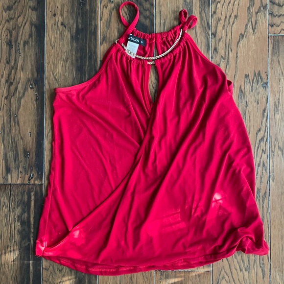 Size XL (definitely fits like Large) dressy “go out” tank.  See below - Picture 1 of 3